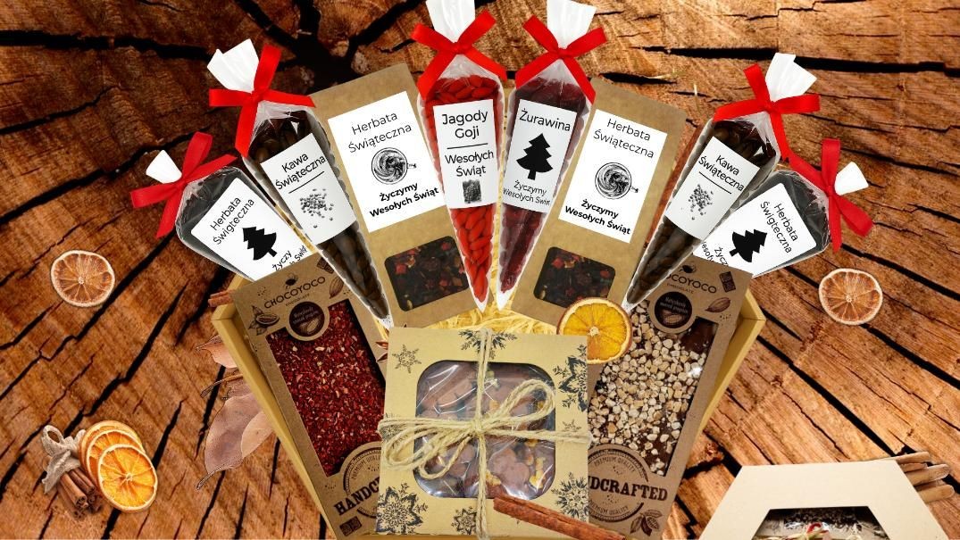 Zestaw prezentowy Z1a z miodami, naturalnymi syropami, świecą z wosku i rzemieślniczymi słodyczami w eleganckim opakowaniu.