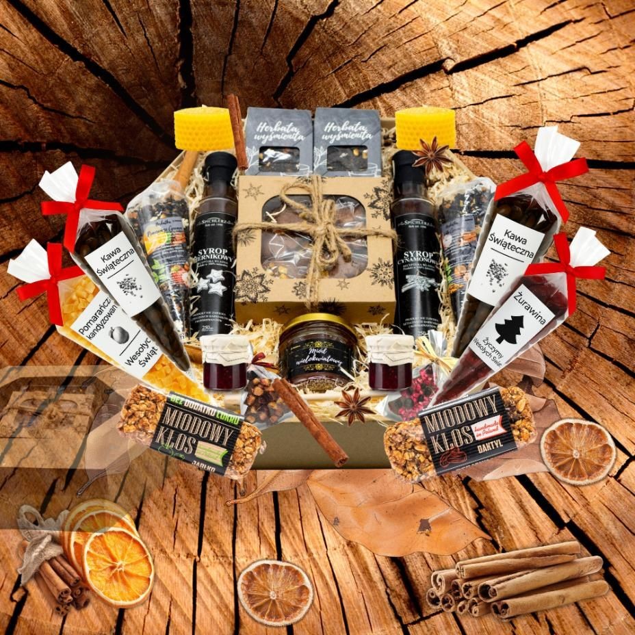 Zestaw prezentowy Premium z miodami, świecą, syropami, herbatami oraz czekoladami, zapakowany w pudełko plaster miodu.